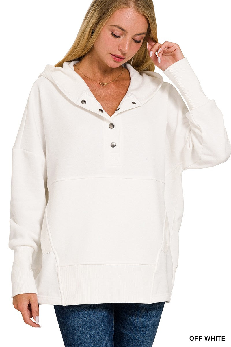 Pullover with buttons and pockets