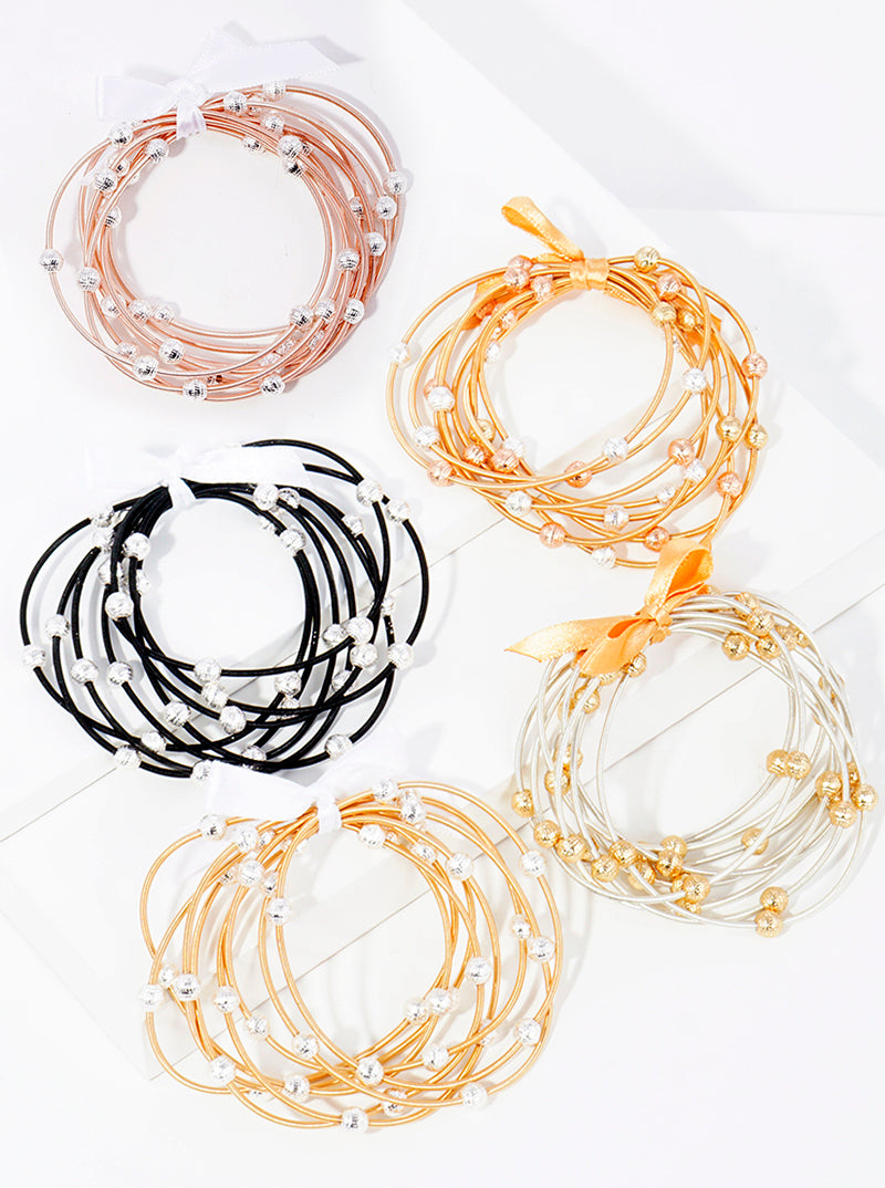 Set of 8 metallic beaded spring wire stackable stretch bracelet