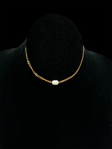 Haute Mess oval freshwater pearl on larger gold chain