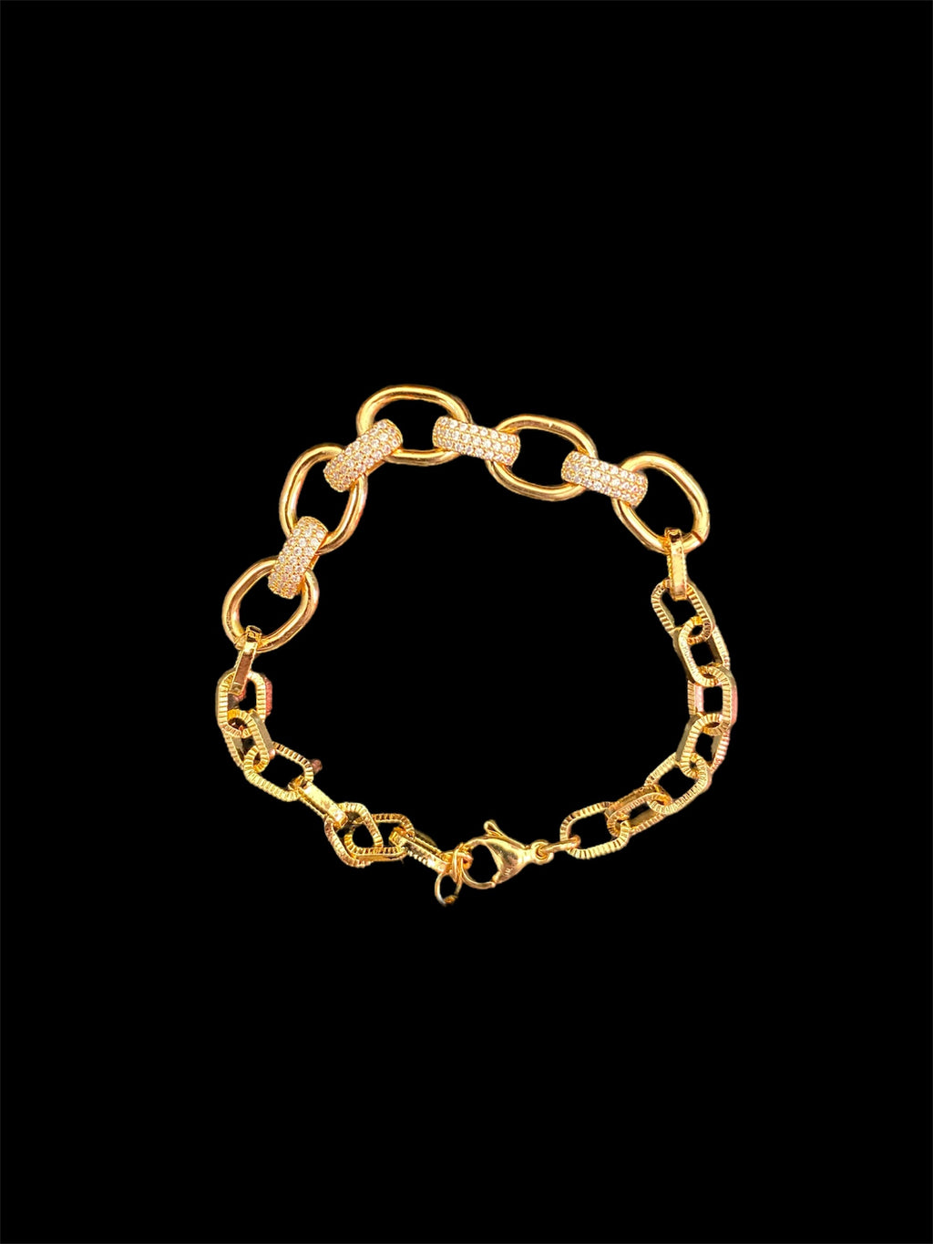 Haute Mess gold ovals bracelet with cz covered links