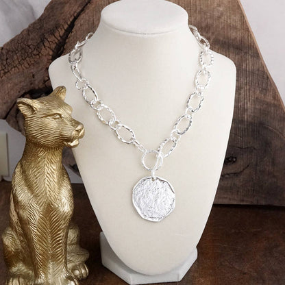 Nomad Glow – Front Toggle Statement Necklace with Hammered Disc