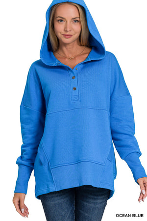 Pullover with buttons and pockets