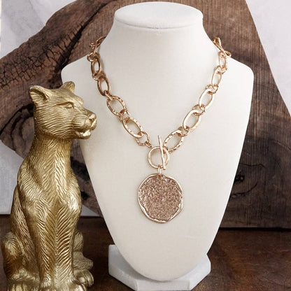 Nomad Glow – Front Toggle Statement Necklace with Hammered Disc